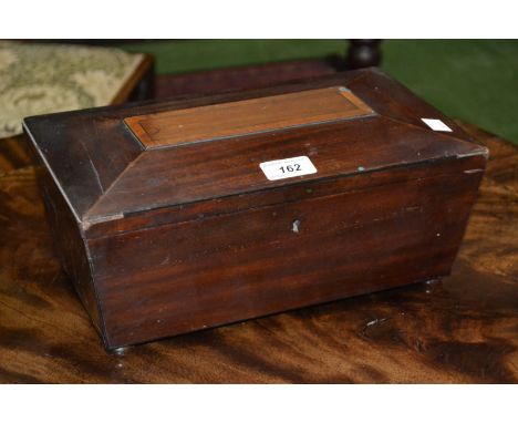 A mahogany and satinwood sarcophagus shaped tea caddy