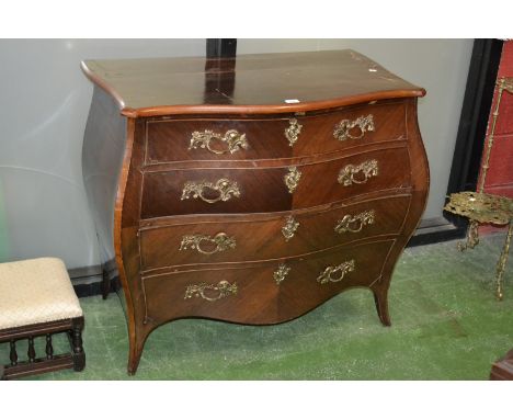A Louis XV Revival kingwood bombe shaped commode, oversailing top above four long graduated cockbeaded drawers, cast Rococo h