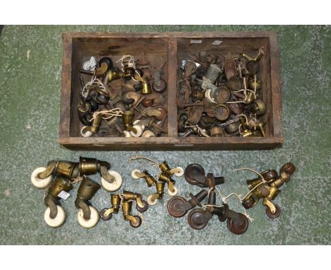 A set of 19th century brass furniture casters; others, ceramic, Bakelite, with fittings; quantity