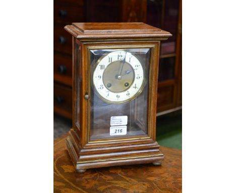 A late 19th century mahogany three-glass mantel clock, 11cm dial with enamel chapter ring inscribed with Arabic numerals, twi