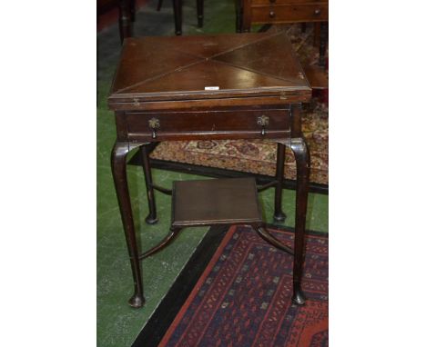 A Victorian mahogany square envelope card table, folding quatre-partite top enclosing an inset green baize lined playing surf