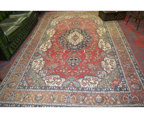 A vintage Persian tabriz carpet, 321cm x 211cm, approx.