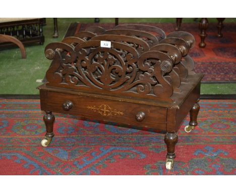 A Victorian mahogany four division canterbury, fretworked dividers, turned spacers and legs, satinwood inlaid drawer to base 