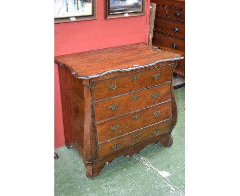 An 18th century Dutch walnut bombe shaped commode, shaped oversailing top above four long graduated drawers, brass bat shaped