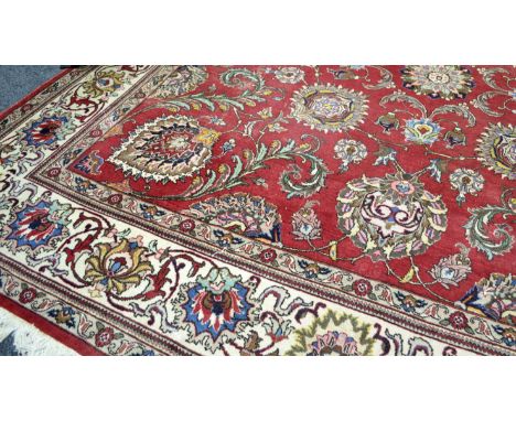 A square Persian tabriz carpet, 348cm x 348cm, approx.