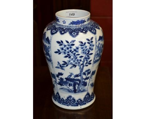 A Chinese shouldered ovoid vase, painted in underglaze blue with a figure crossing a bridged river astride a mule in a mounta