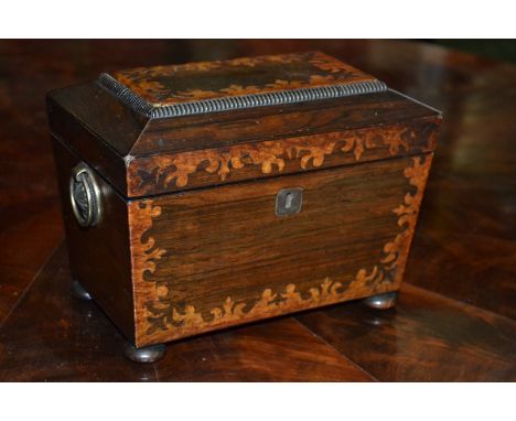 A William IV rosewood and marquetry sarcophagus tea caddy, gadrooned cornice, hinged cover lined to verso with velvet, two di
