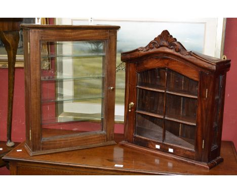 A small wall hanging single door display cabinet, glazed door, two shelf interior;  another, five glass shelves (2)