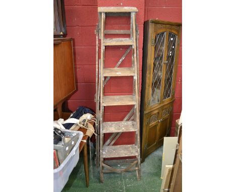 A set of vintage wooden step ladders