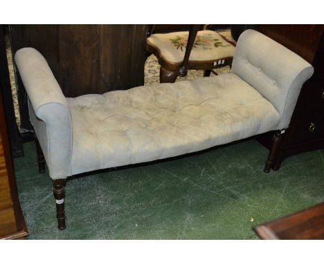 A Victorian window seat, scrolling ends, button upholstered seat, turned legs. 85cm high x 125cm wide x 46cm deep.