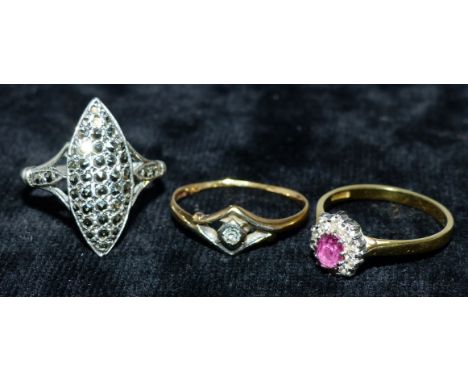 A lady's 18 carat diamond and ruby cluster dress ring, 2.4 gm; a single stone diamond dress ring, 1.6 gm; a marcasite ring