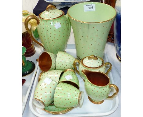 A Carltonware 15 piece coffee set, green and red polka dot with gilt interiors, and a similar vase (hairline crack to vase)