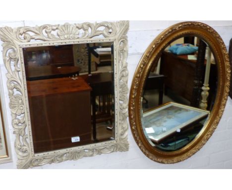 A bevelled glass wall mirror with carved painted frame; 2 others