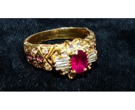 A gem set yellow metal dress ring, (tests as 18c) 10 g