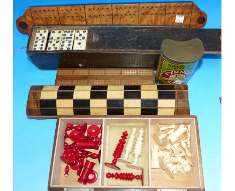 A 19th century chess set with linen mounted inlaid board; set of dominoes; etc.