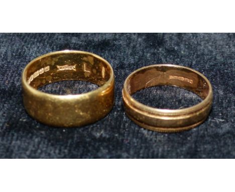 An 18 carat hallmarked gold wedding ring, 4.8 gm; a 9 carat hallmarked gold wedding ring