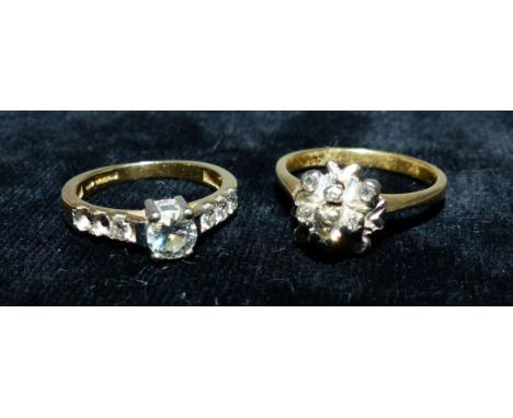 A modernist diamond cluster ring, stamped '18CT'; an 18 carat hallmarked gold ring set diamond simulants (a.f.), 8.2 gm