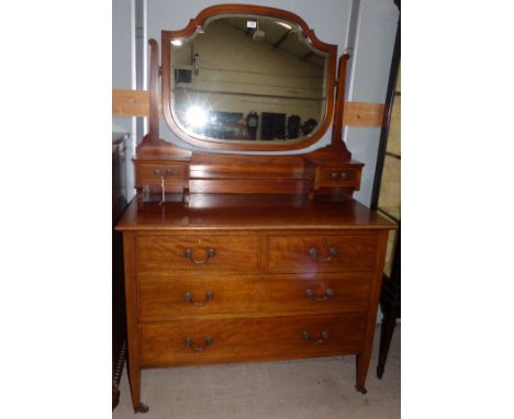 An inlaid mahogany dressing table with arched mirror, 2 long, 2 short, and 2 jewellery drawers