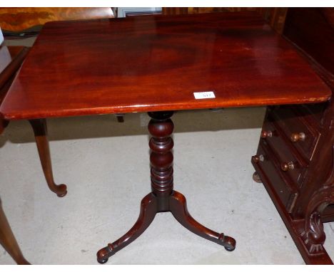 A mahogany tilt top occasional tripod table on turned column with rectangular top