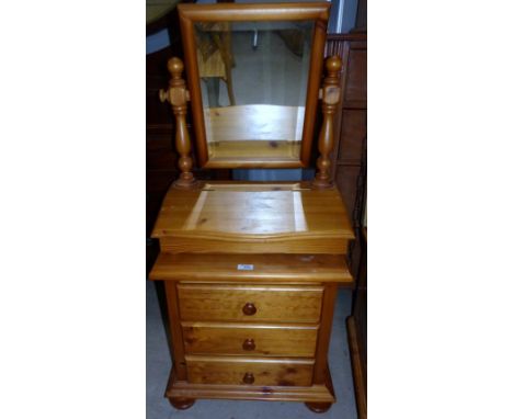 A pine bedside chest of 3 drawers; a dressing table mirror