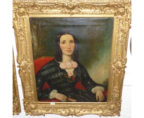 A 19th century oil on canvas:  portrait of a woman with pink bow, holding a prayer book, 30" x 24", gilt framed