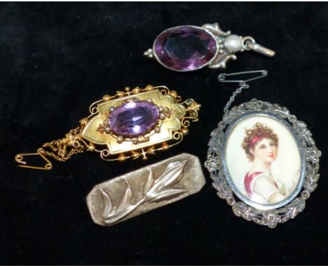 A neo-classical style portrait miniature in marcasite set brooch; a Victorian amethyst brooch; 2 others
