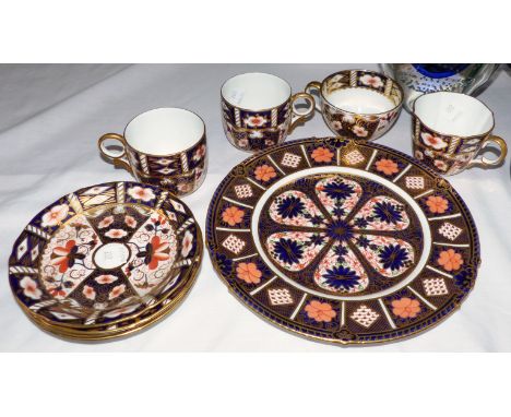 Four Royal Crown Derby cups and saucers; a similar plate