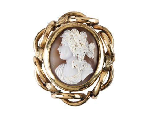 Two shell cameo brooches and one shell cameo, mid-19th century1st: Oval, carved to depict Bacchus in profile, facing left and