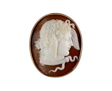 A shell cameo brooch, mid-19th centuryOval, carved to depict Medusa in profile, facing right with winged headdress and serpen