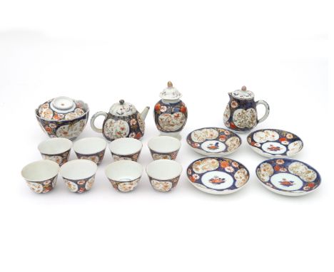 A part teaservice, Imari-style, China, 18th century. A teapot, milk jar, tea caddy, lidded bowl, eight cups and four saucers.