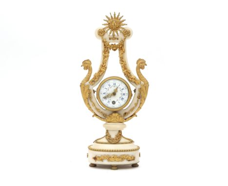  An alabaster chimney clock, France, mid. 19th century. The alabaster case with ormolu / firegilt mounts, crowned with a sun,