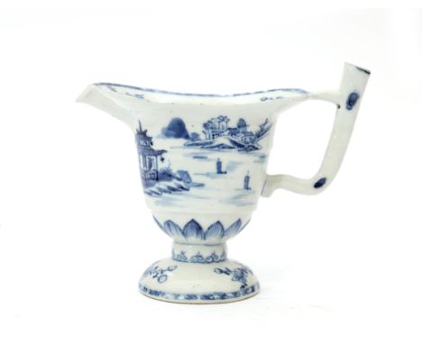  A Chinese jug, 18th century. Probably part of a washbowl and pitcher-set. Decorated with a landscape in blue underglaze. Hai