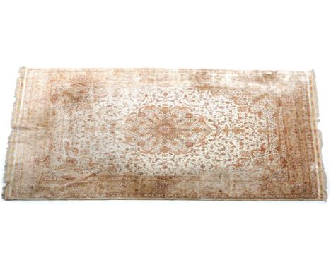  A silk Tabriz rug from Iran, first half of the 20th century. Signed. This type of rugs is named after the Iranian place Tabr