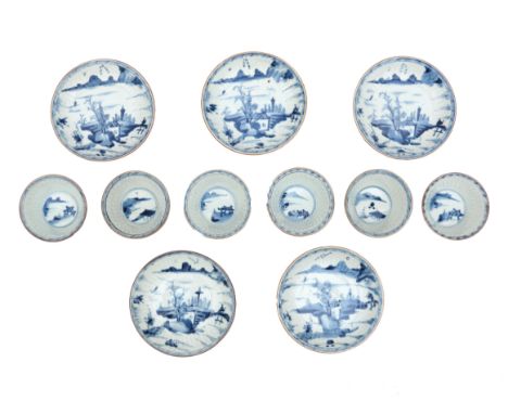  Six cups and five saucers of Chinese porcelain with a decoration of a landscape with figures in blue underglaze. Marked with