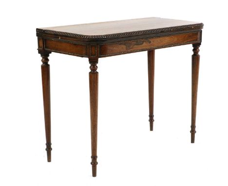 A Regency rosewood and gilt metal mounted card table,with a moulded edge over turned and tapering supports,91.5cm wide44.5cm 