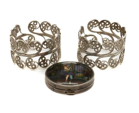 A small silver compact,by Thomas Lyster Mott, Birmingham 1929, of circular form, the lid with a butterfly painted scene of a 