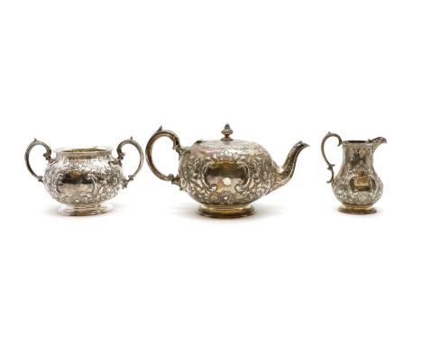 A Victorian silver three piece tea service,by Martin, Hall & Co, Sheffield 1894, comprising a teapot with ivory insulators, 1