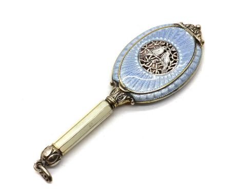An Austrian enamelled silver novelty compact,1930s, the compact of oval form decorated throughout in powder blue guilloche en