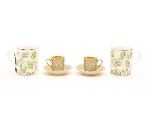 A pair of Hermes porcelain mugs, 20th century, Qatar Foundation, with scrolling leaf decoration9cm hightogether with a Yildz 
