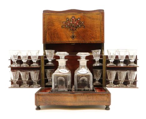 A rosewood and boulle work liqueur set,late 19th century, French, the serpentine hinged front enclosing a fitted interior, wi