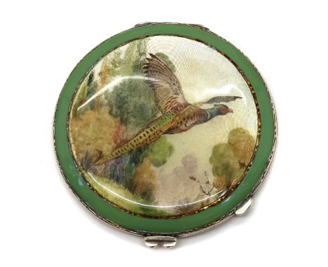 An enamelled silver compact,by Hardy Brothers Ltd., Birmingham 1939, of round form, the lid with guilloche enamel and a green
