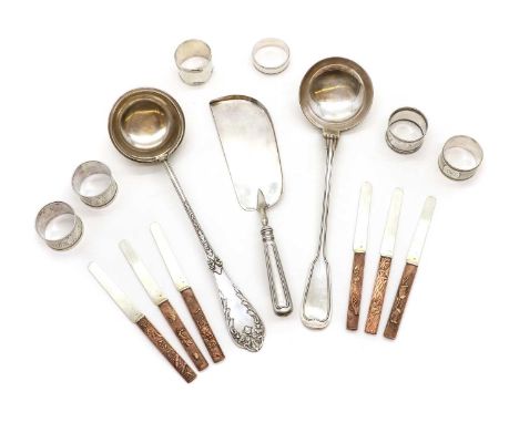 A collection of silver items,comprising a German silver ladle, 800 grade, 36cm long, four French silver napkin rings, and a s