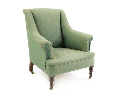 A Victorian armchair,upholstered in a pale green floral fabric, with swept arms, raised on turned mahogany front supports, on