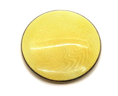 An Art Deco enamelled silver compact,by Horton &amp; Allday, Birmingham 1931, disc-shaped, throughout the exterior with yello