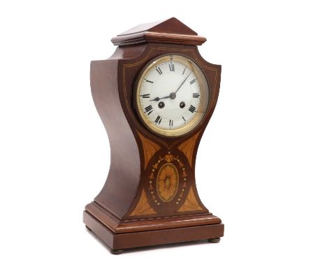 An Edwardian inlaid mahogany mantel clock,of waisted shape, the enamel dial supporting a drum movement striking on a gong,38c