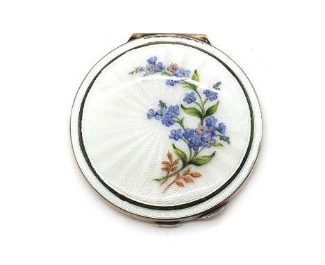An enamelled silver compact,by Garrard &amp; Co., Birmingham 1967, of round form, the lid enamelled in white over an engine-t