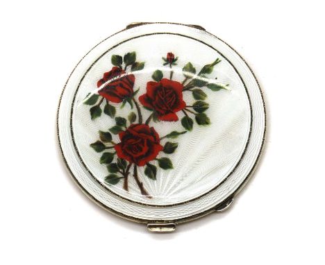 An enamelled silver compact,by Henry Clifford Davies, Birmingham 1955, of round form with a bevelled edge, the lid decorated 