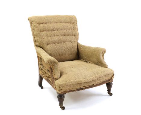 A large Victorian armchair,upholstered in hessian, on mahogany turned supports terminating in castors,78cm wide96cm deep92cm 