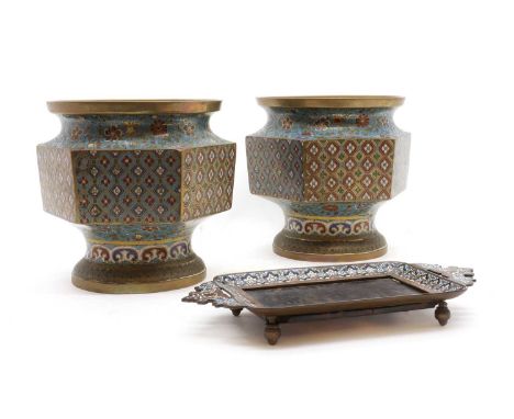 A pair of Chinese cloisonné vases,20th century, of hexagonal tapering form, rising to a flared mouth, each side decorated wit