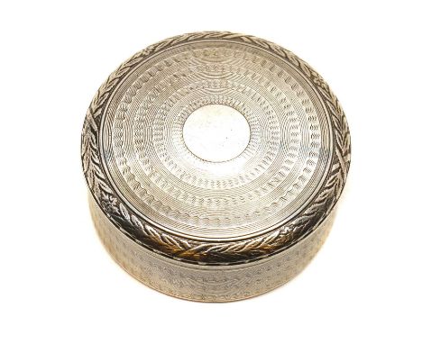 A French silver snuff box,circa 1910, by Auguste Leroy &amp; Cie., of round form with a pull-off lid, throughout with engine-